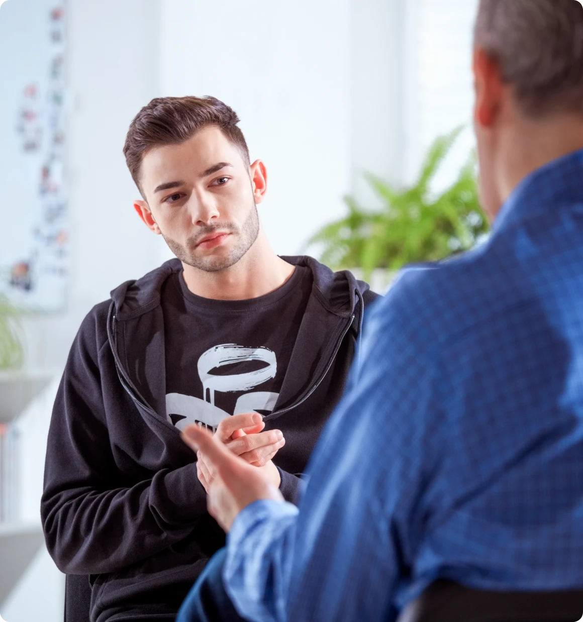 Counseling session with focused young man
